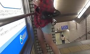 Asian ho pees in metro pedestal