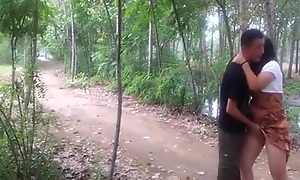 Crazy asian buckle makes a sextape on their bike in the forest